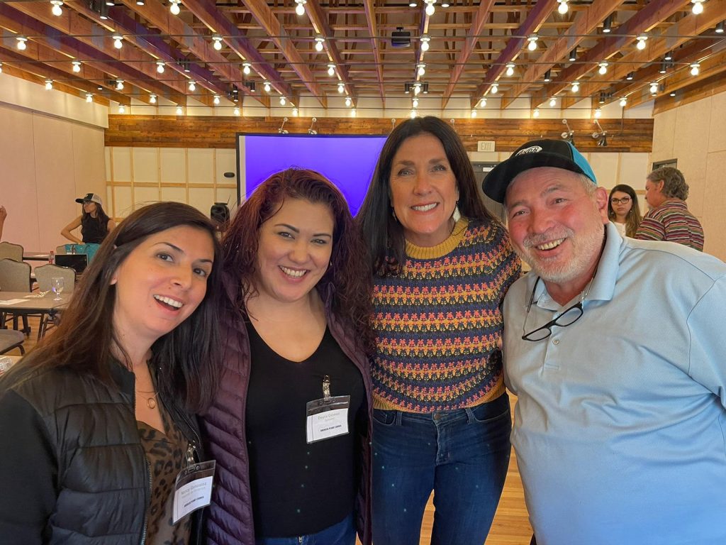 Shelly Nutt and attendees of the Mexican Manufacturers Tour smiling at the camera. 